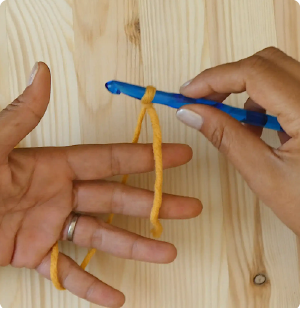 How to Crochet the Chain Stitch - Yarn around hand back